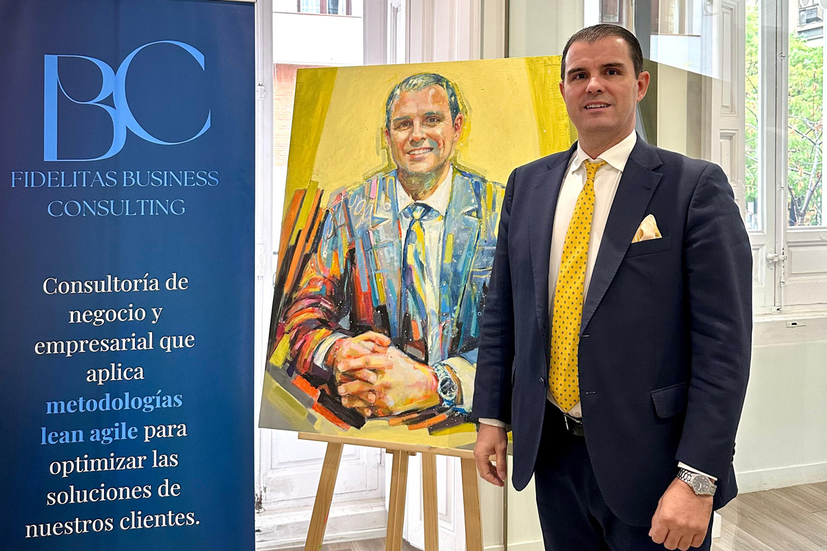 Rubén Puga, the art banker, at the offices of the Fidelitas Group with his portrait.