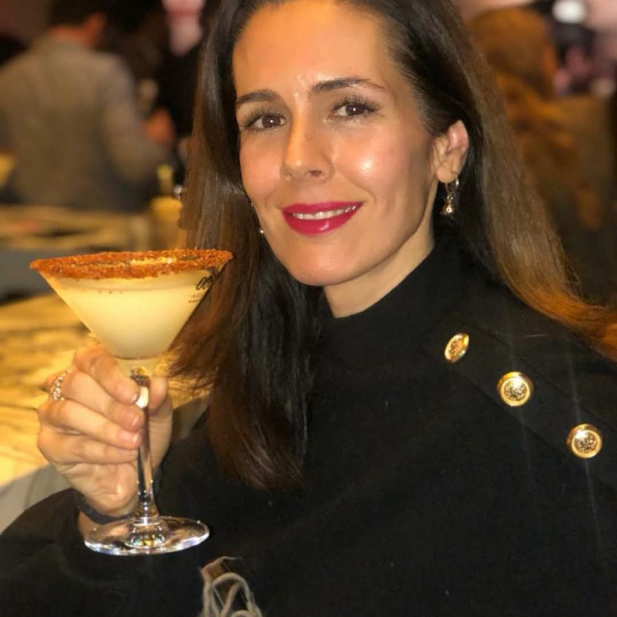 Mayra Alvarez toasts everyone.